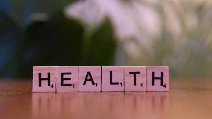 wooden letter tiles spelling the word Health