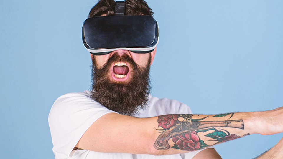 Man wears a VR headset for Simplified Entertainment's Smash It No Mess Rage Room. 