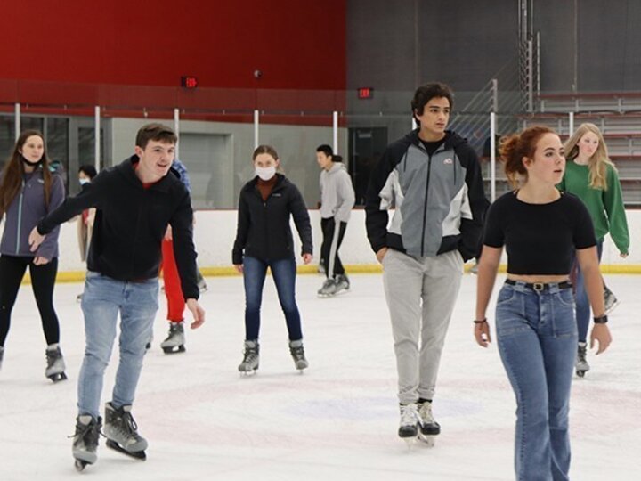 Students ice skating at Breslow Ice Center.